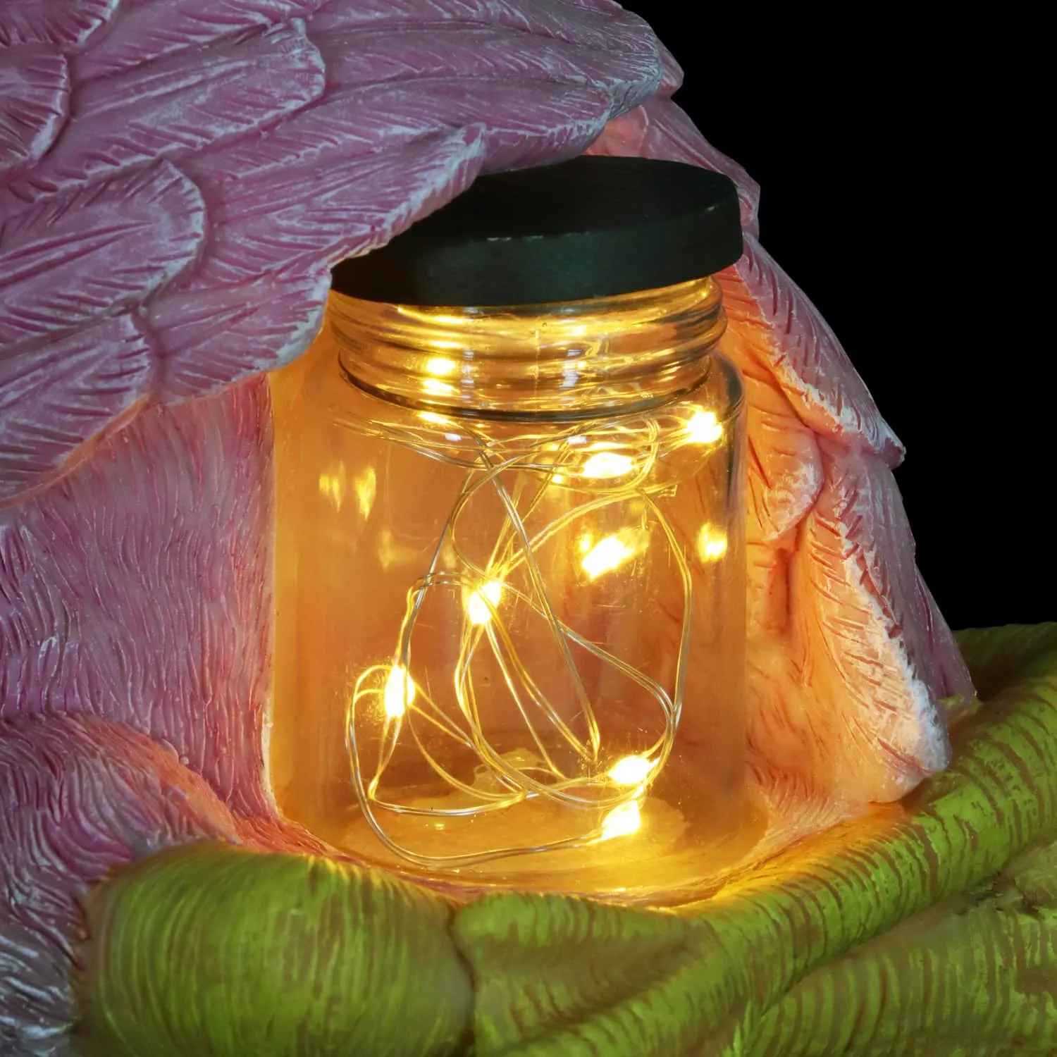 Solar Sitting Flamingo Garden Statue Holding a Glass Jar with Six LED Firefly String Lights